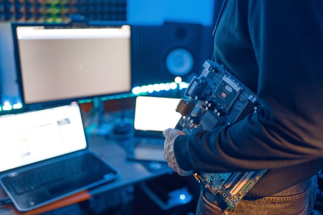 computer-engineer-holds-pc-motherboard.jpg